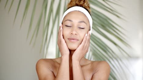 woman with makeup touching her face