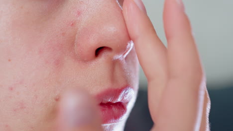 close-up of hands massaging face with skincare, focusing on gentle application for smoother, rejuvenated skin, a soothing and relaxing beauty treatment highlighting the skincare process