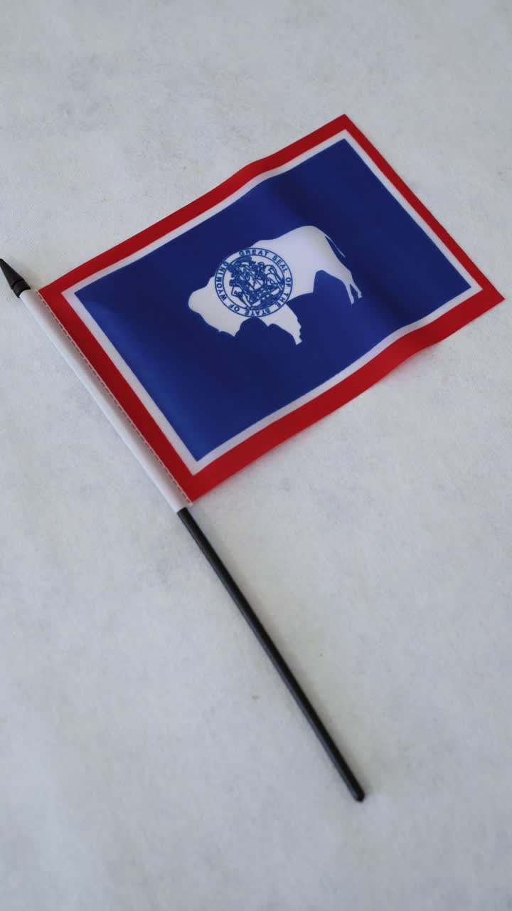 Vertical shot of Wyoming state flag. White background