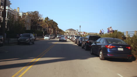 driving plate front, car driving through downtown charleston, day