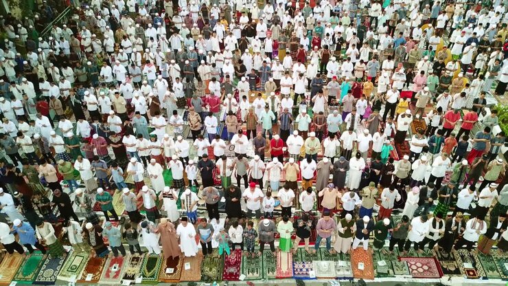 Muslim people praying Eid Al Fitr together