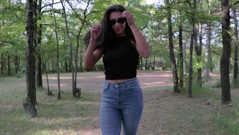 Girl-with-long-black-hair-walking-in-a-park-in-slow-motion