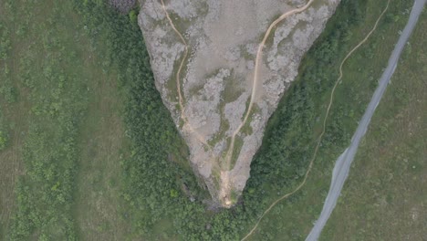 Above-Eyjan-rock-formation-at-Asbyrgi-woodland-canyon-in-Iceland,-top-down