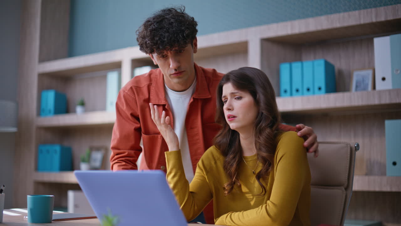 Frustrated colleagues reacting failure at office closeup. Concerned coworkers