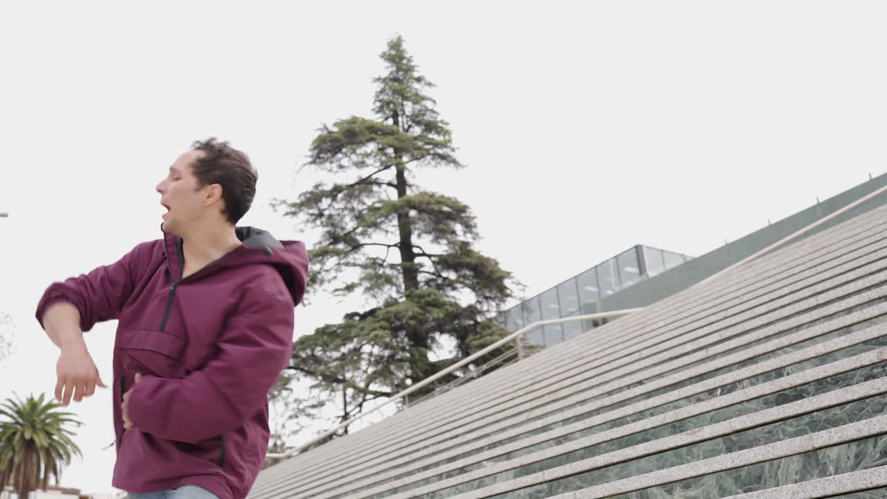 Man dancing hip hop in urban environment