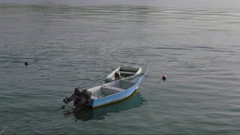 Small-wooden-engine-boat-floating