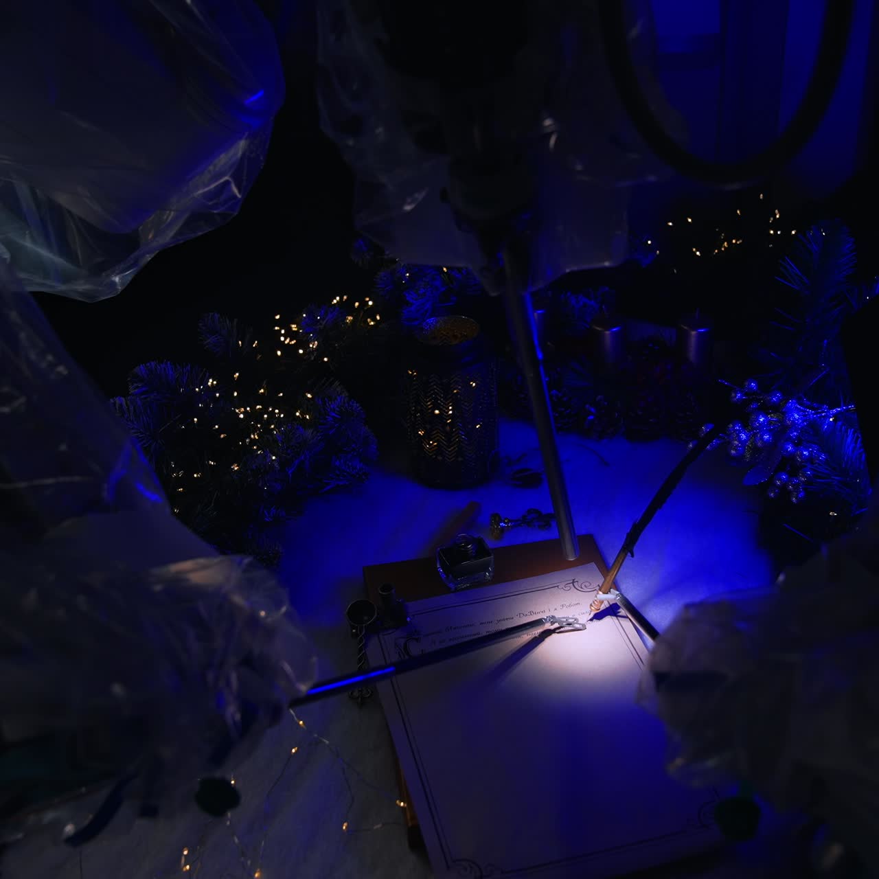 Futuristic surgical equipment using writing pen to write a letter. Dark room with Da Vinci robot over operational table. Christmas decoration at backdrop