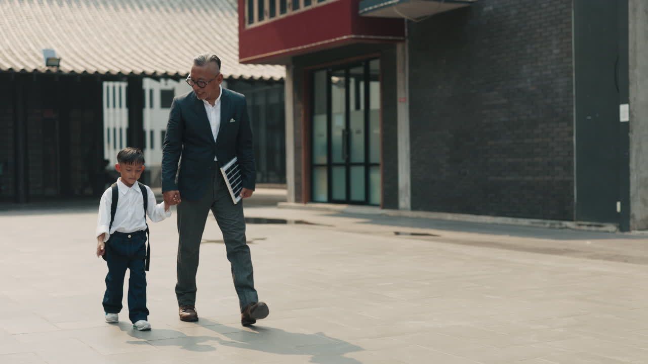 Man and Child Walking to School
