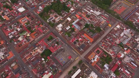 Top-down-view-of-Antigua-colonial-city-at-Guatemala,-aerial