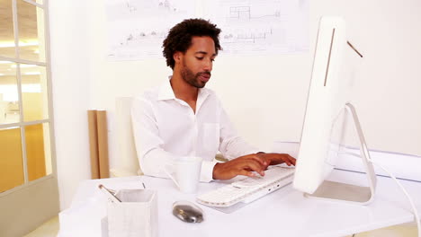 Businessman-working-at-his-desk