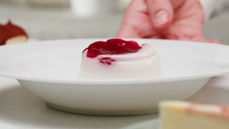 preparing a panna cotta dessert