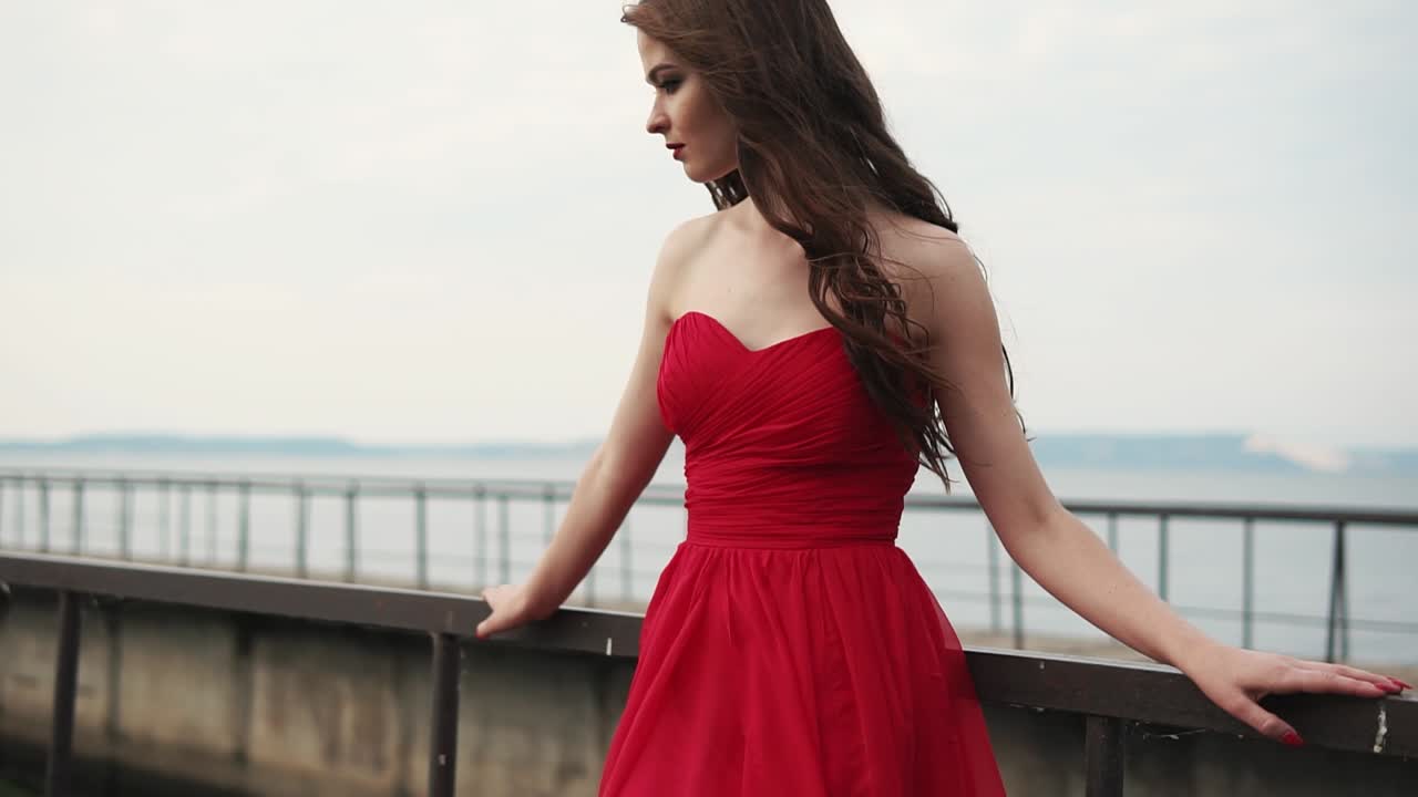 Woman in a Red Dress by the Lake