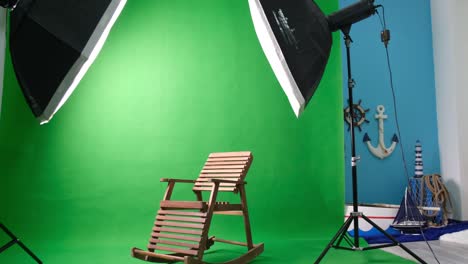 photo or video studio with two hexagone studio lights. green screen and fixed chair