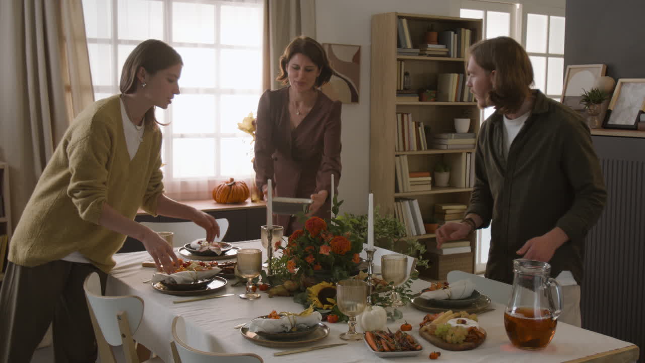 People preparing a festive Thanksgiving dinner at home