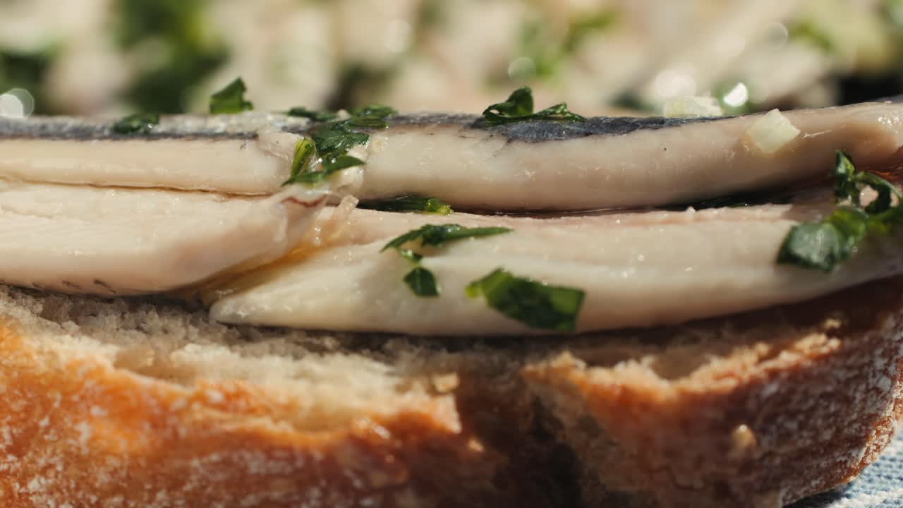 Fresh Sea sardines and Anchovy Fish and Mullus On Display On Ice On Market Store Shop. Seafood Fish Background, close up stand of small salty white fish.