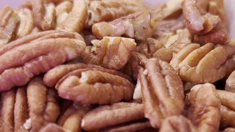 exteme close up macro shot of pecan halves forming a textured background, highlighting themes of healthy eating, baking, ideal for showcasing nutrition and delicious recipes