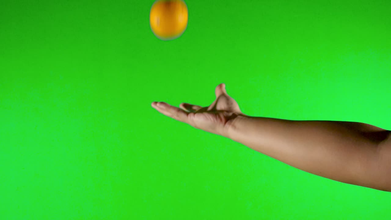orange with green background throwing up orange with green screen - green background