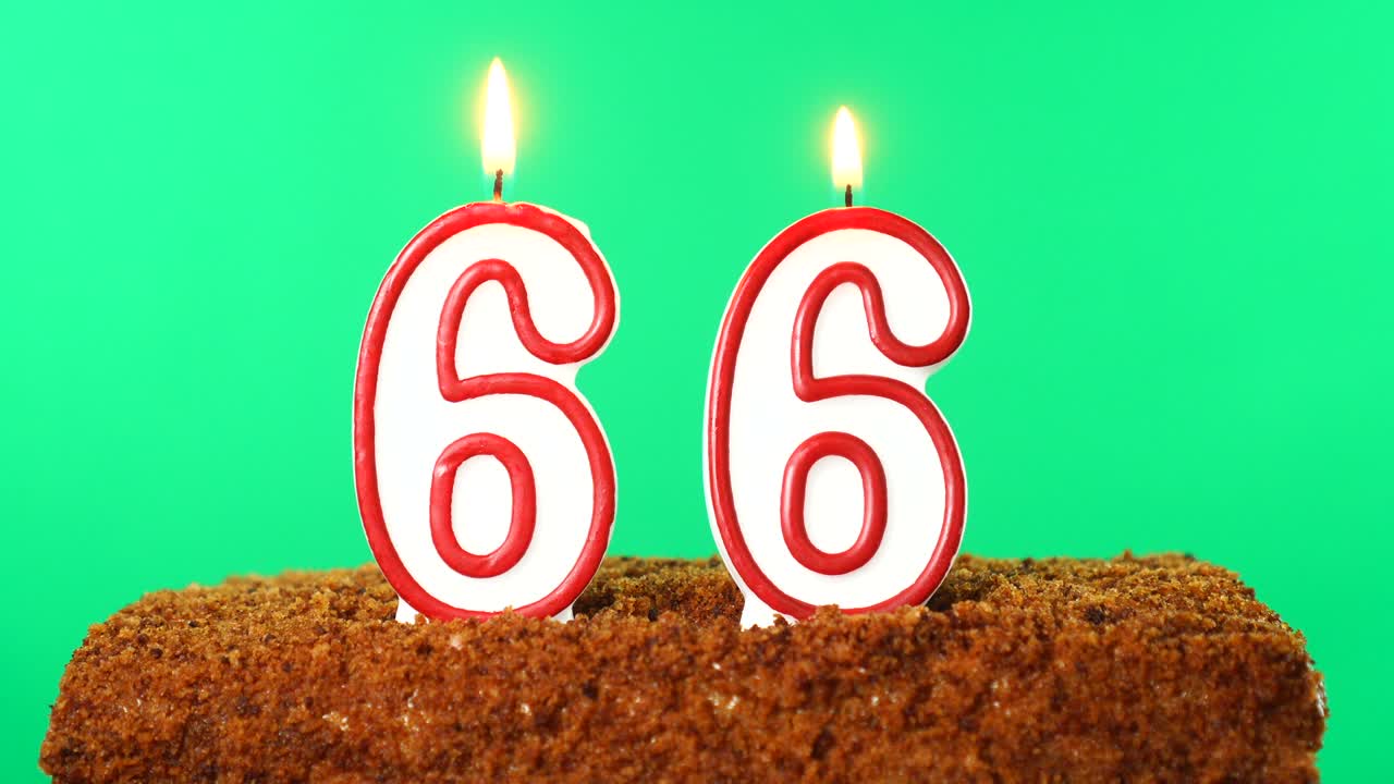 Cake with the number 66 lighted candle. Chroma key. Green Screen. Isolated