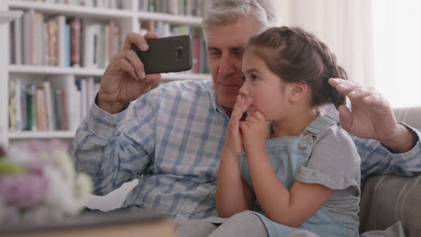 grandfather-and-child-having-video-chat-using-smartphone-little-girl-sharing-vacation-weekend-with-family-grandpa-enjoying-chatting-on-mobile-technology-at-home-with-granddaughter