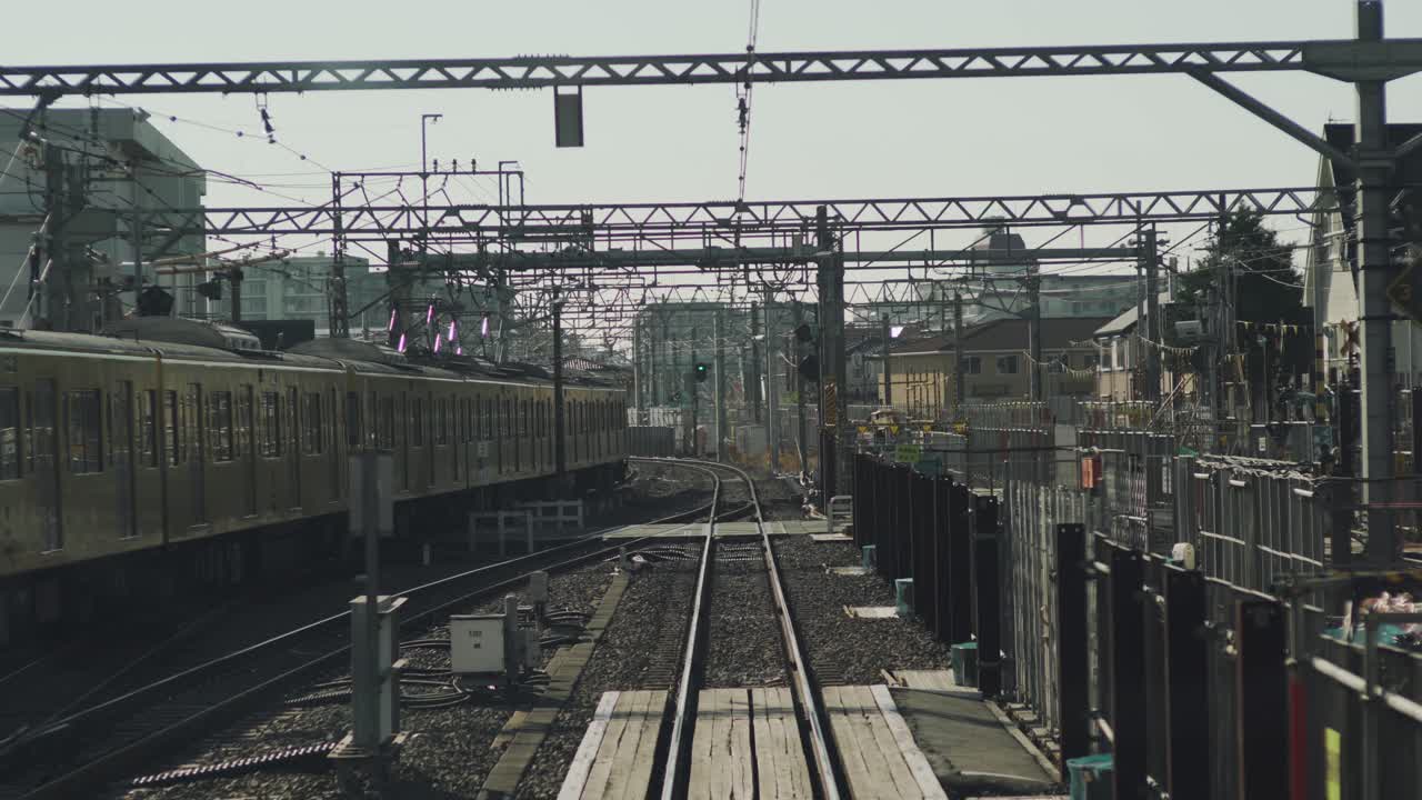 Rear View Shot Inside A Moving Train In Tokyo, Japan In Slow Motion - POV - wide shot