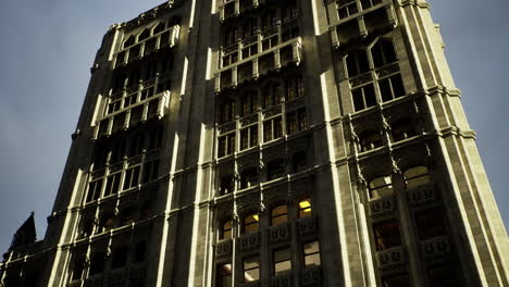 historic architecture of a tall building reflecting sunlight at dusk