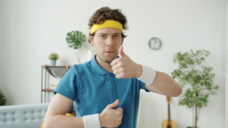 man posing in retro sports outfit