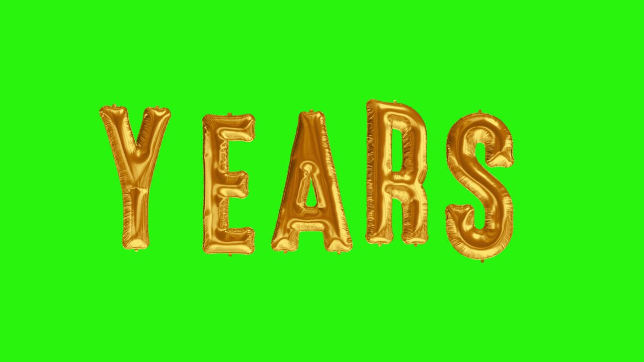 Word YEARS from helium golden balloon letters floating on green screen