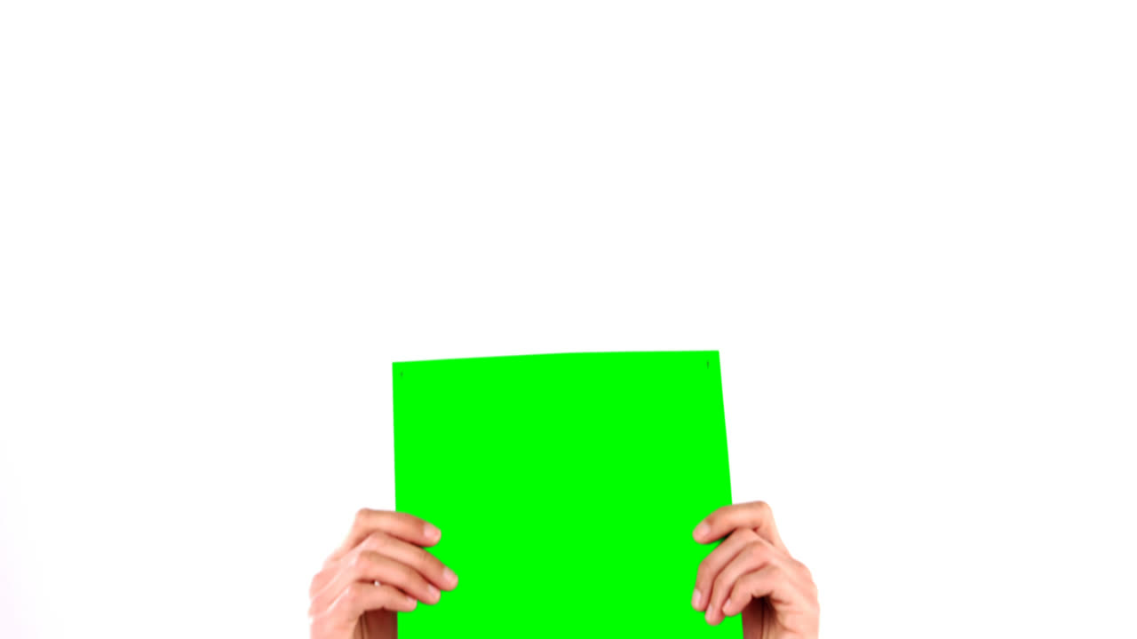 Man holding green blank paper
