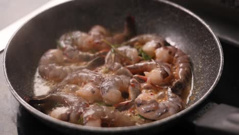 cooking shrimp in a pan