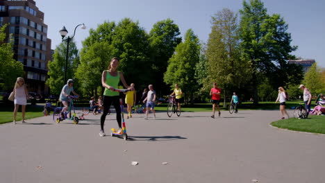 enjoying a sunny day in the park: scooter rides and family picnics