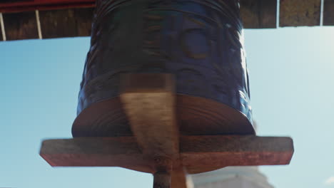 Buddhist-prayer-wheel-brings-peace-and-serenity-in-this-sunny-day-tracking-shot