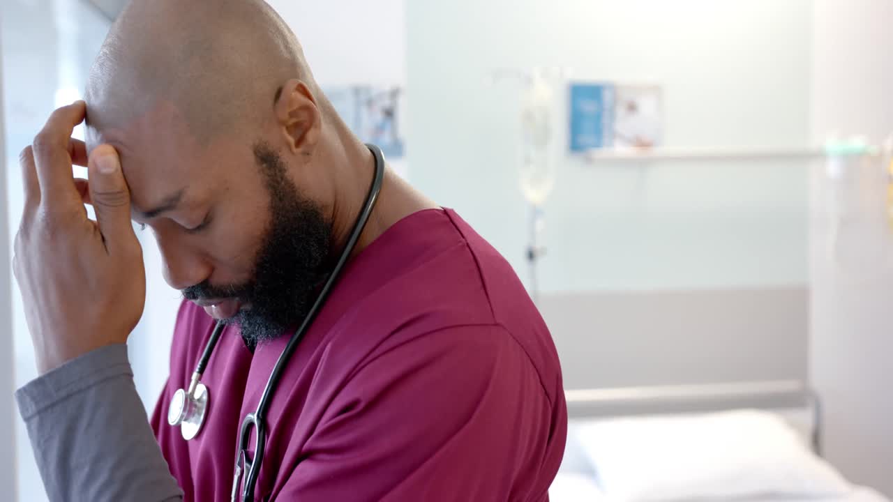 Worried african american doctor in hospital room, slow motion