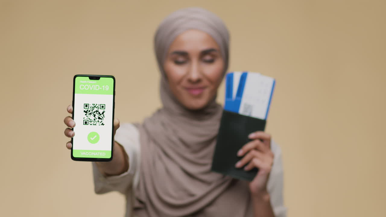 Woman presenting digital health pass and travel documents