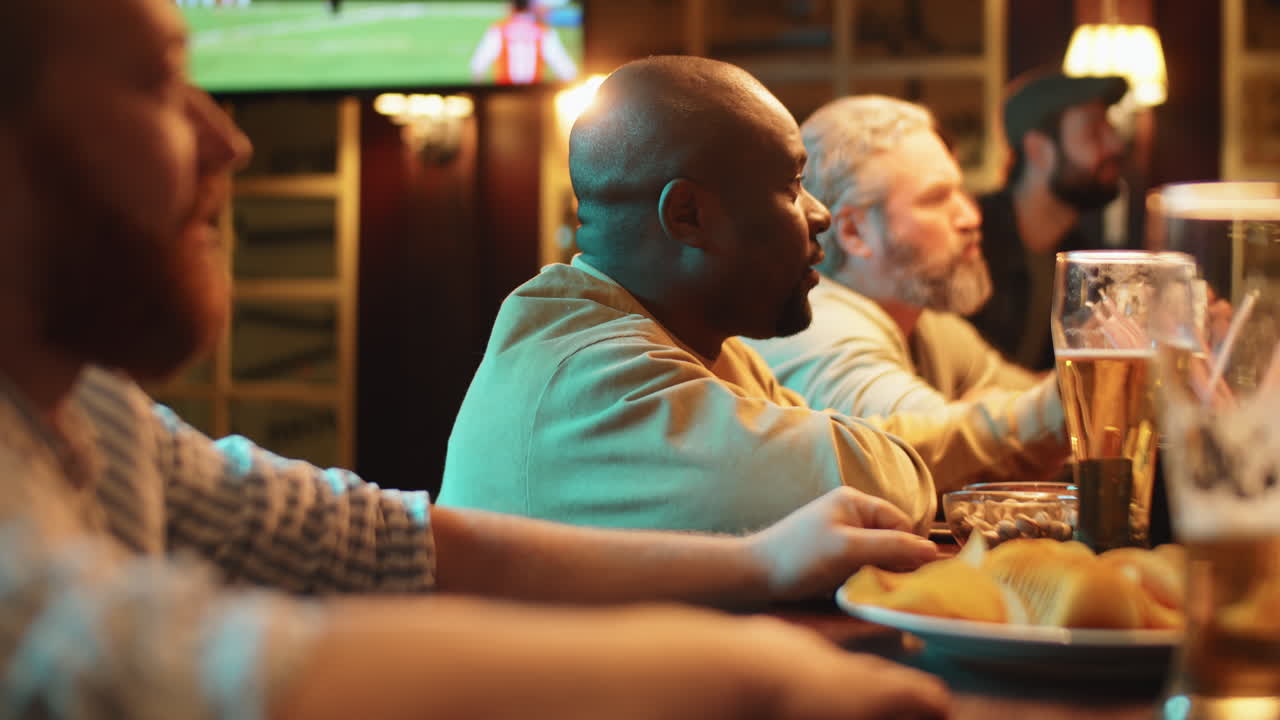 Group of Men Watching Sport Event