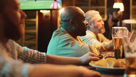 group of men watching sport event