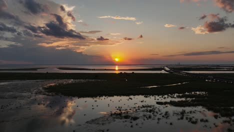 colorful sunset over mobile bay, alabama