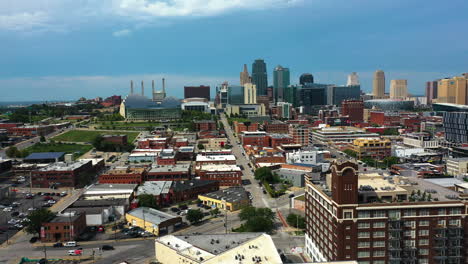 aerial tracking shot of the kansas city cityscape, sunny day in missouri, usa