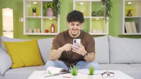 young man satisfied with the new application on the phone.