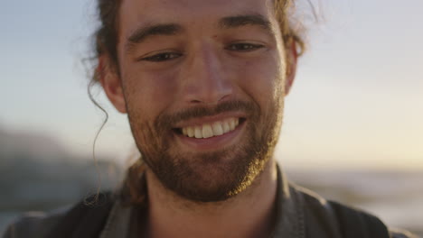 close up portrait of handsome young man smiling cheerfully