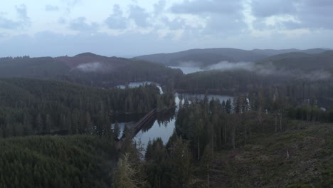 Train-trestle-and-railroad-tracks-crossing-Tahkenitch-Lake-in-Oregon