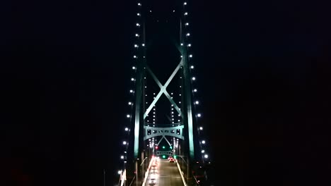 stationary shot of lions gate bridge in vancouver at night