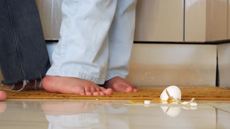 broken egg on kitchen floor