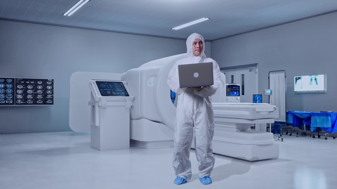 Full Body Of Asian Male Scientist Typing On A Laptop And Looking Around With MRI Machine In The Hospital