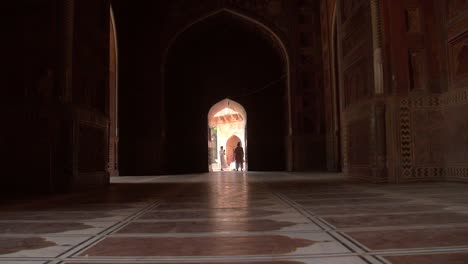 Handheld-Shot-of-People-in-an-Archway