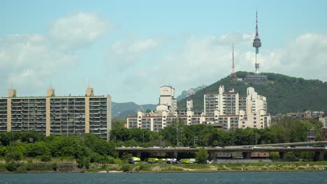 n namsan seoul tower on bright sunny and cloudy day, view from the bank of han river in summer