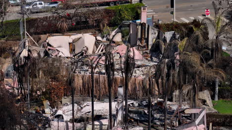 aftermath of a house fire: a destroyed home and burnt landscape