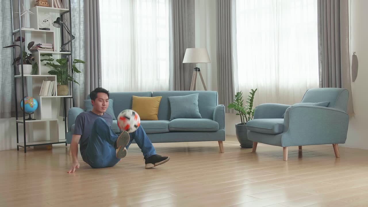 Asian Man Show Skill With Soccer Ball In Living Room, Soccer Freestyle