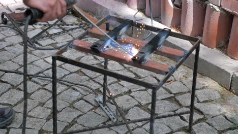 welding metal frame outdoors