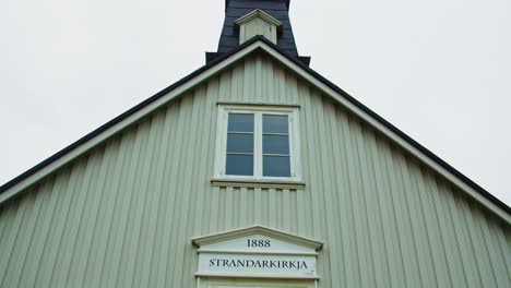 Tilt-up-of-small-picturesque-church-in-Iceland