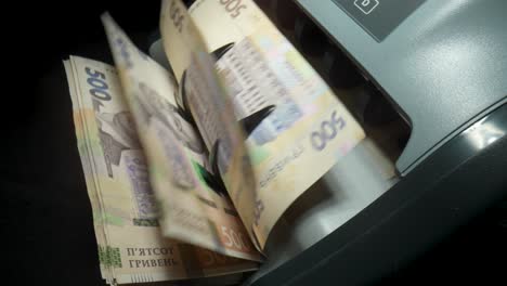 counting ukrainian hryvnia with a bill counter